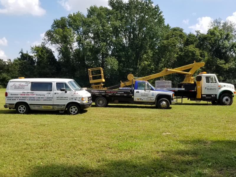 Robinson Inc work trucks on site